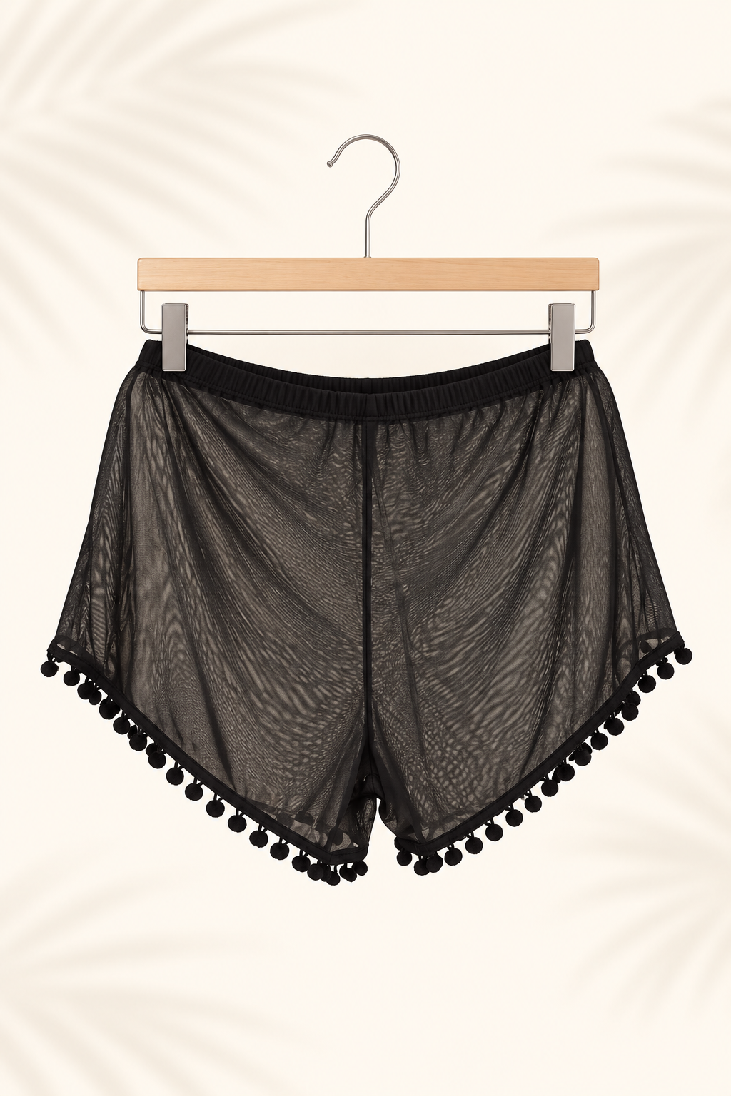 Short de playa negro con pompones · Talla L