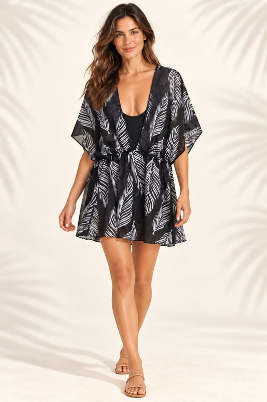 Vestido corto de playa negro con estampado de hojas